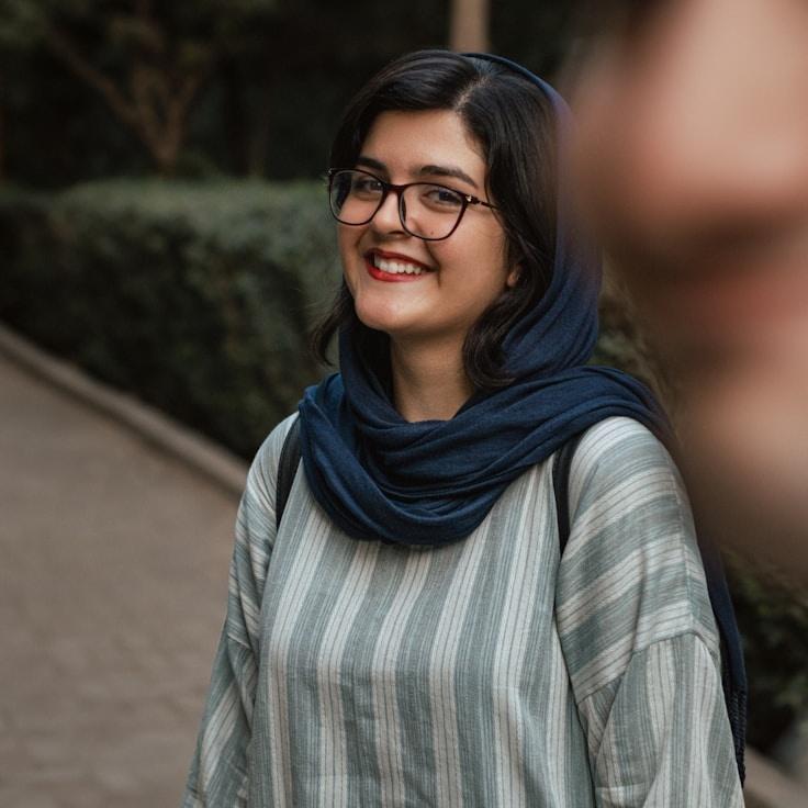 Riya Kapoor, Lead Design Curator at Vivid Harbor Lane, reviewing corporate floral arrangements